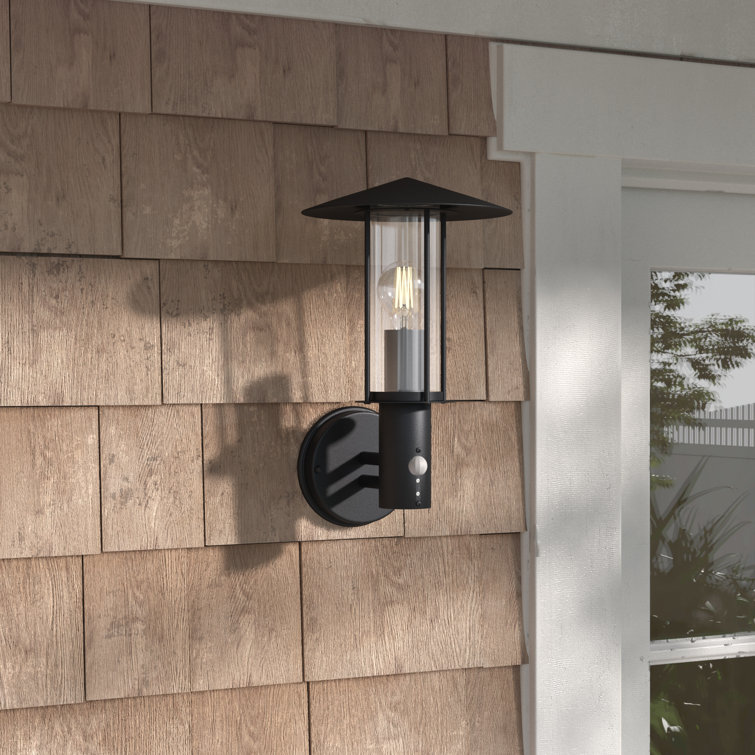 Outdoor armed store sconce